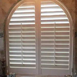 Bathroom window with custom plantation shutters closed for privacy