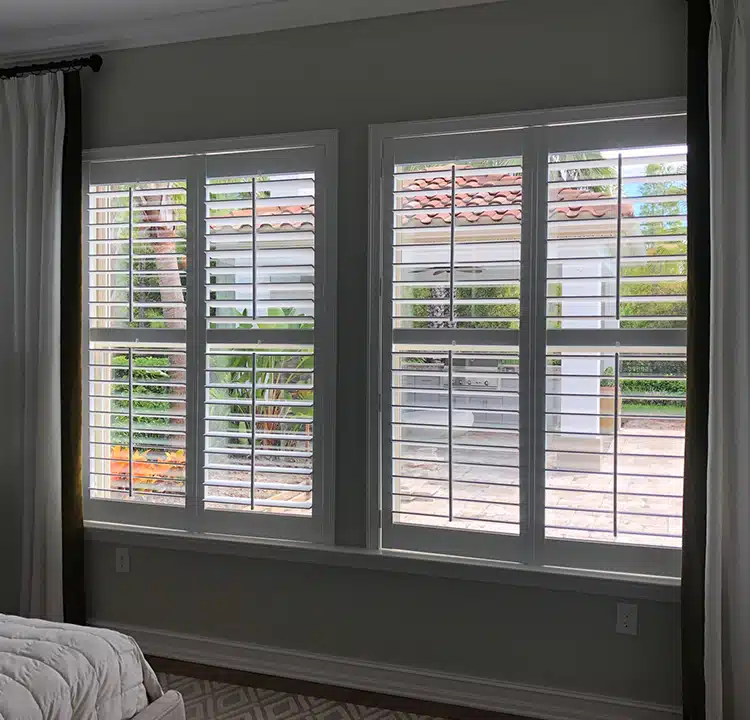 bedroom window with solid composite shutters in odessa florida