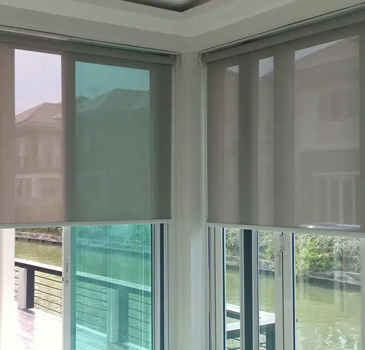 Roller Shades over a window of a waterfront home