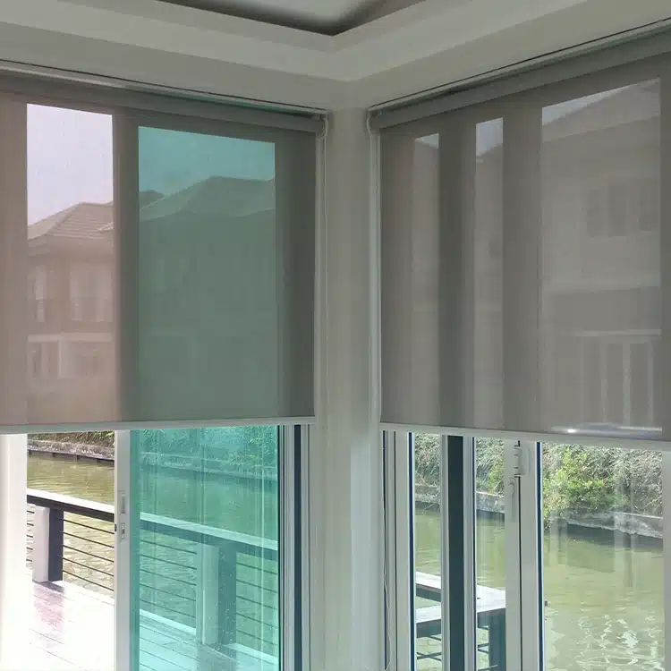 Roller Shades over a window of a waterfront home